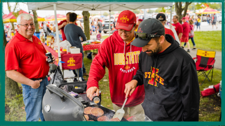 men barbecuing at a tailgate party